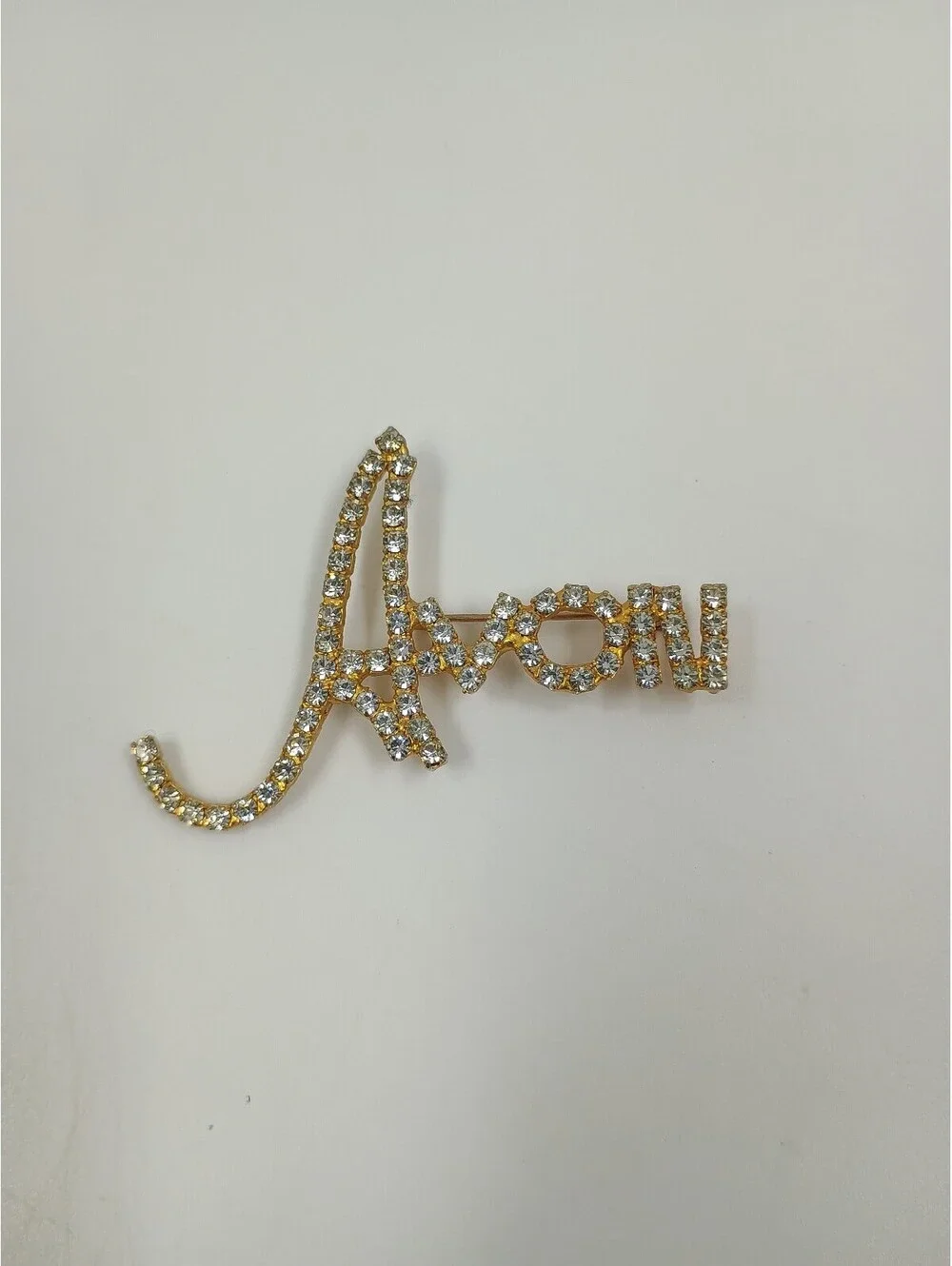 Avon Gold Tone Rhinestone Script Brooch Pin